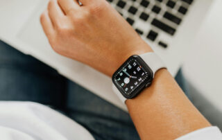 A watchface on the wrist of a person looking to see what time it is.