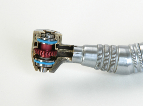 Ceramic bearing inside a high speed handpiece repair head showing precision internal components and turbine mechanism.