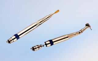Two handpieces with different head attachments superimposed over a blue background.